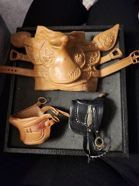 LOT OF PLAY HORSE SADDLES